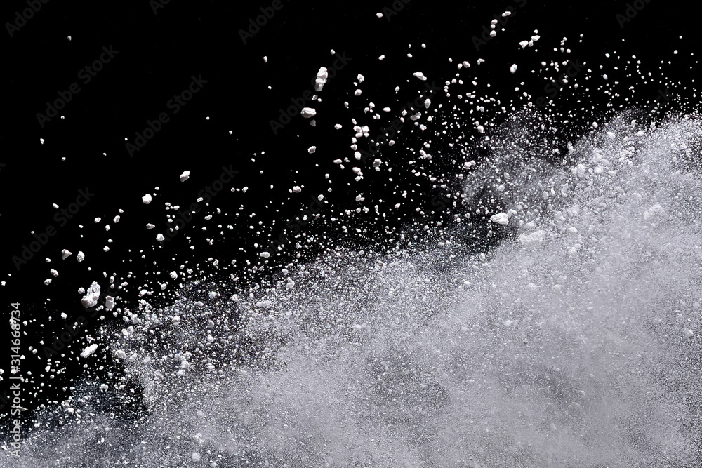 White powder explosion isolated on black background. White powder explosion isolated on black background.