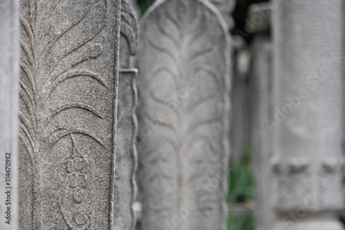 Narrow tall tombstones on old ancient graves in Turkey, Istanbul