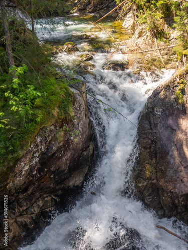 Waterfall Wodogrzmoty Mickiewicza in High Tatras in summer photo