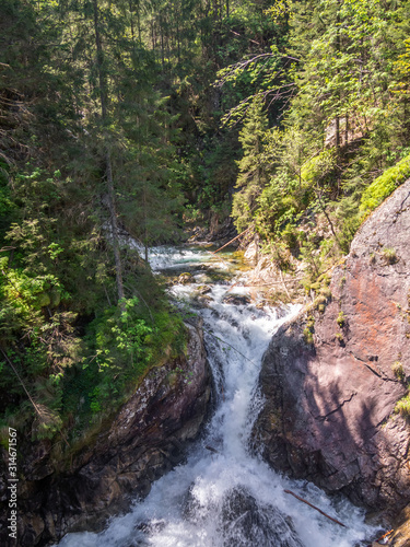 Waterfall Wodogrzmoty Mickiewicza in High Tatras in summer photo