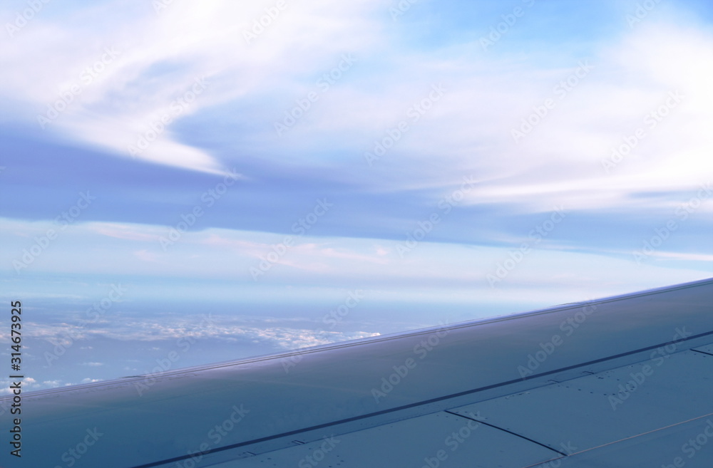 plane wing and cloud floating on sky through window frame plane wing and cloud floating on sky through window frame