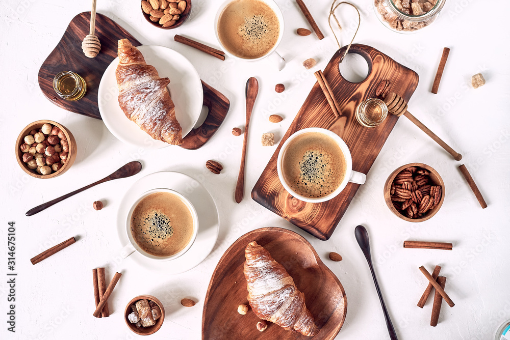 breakfast pattern, croissant, coffee, honey, cinnamon sticks, nuts, sugar. Good morning concept.