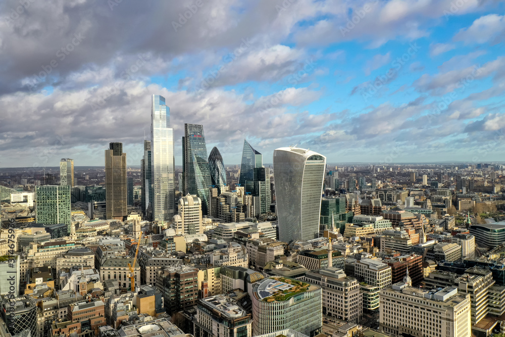 London city centre aerial panorama view: financial district, Thames river, Belfast, skyscrappers, warf and buildings and St. Pauls Cathedral, Tower Bridge and The Tower