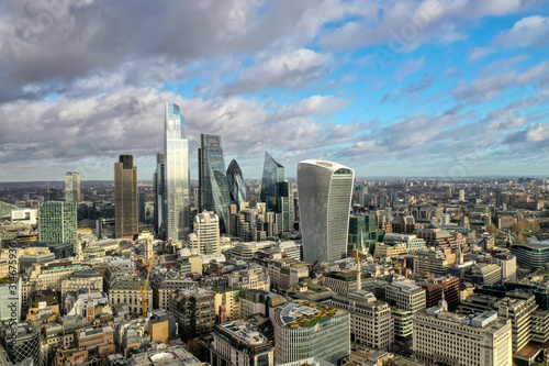 London city centre aerial panorama view  financial district  Thames river  Belfast  skyscrappers  warf and buildings and St. Pauls Cathedral  Tower Bridge and The Tower