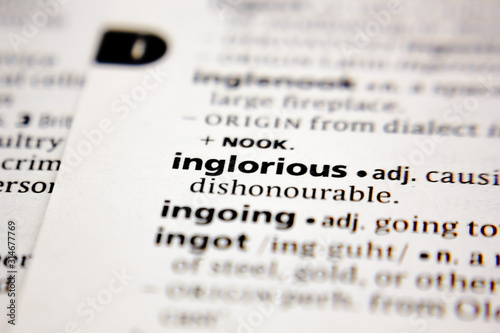 Word or phrase inglorious in a dictionary. photo