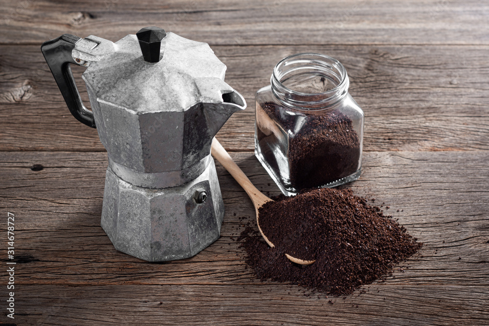 still life photography : ground coffee on old wooden table with old Italian  style espresso maker (moka pot) Stock Photo | Adobe Stock