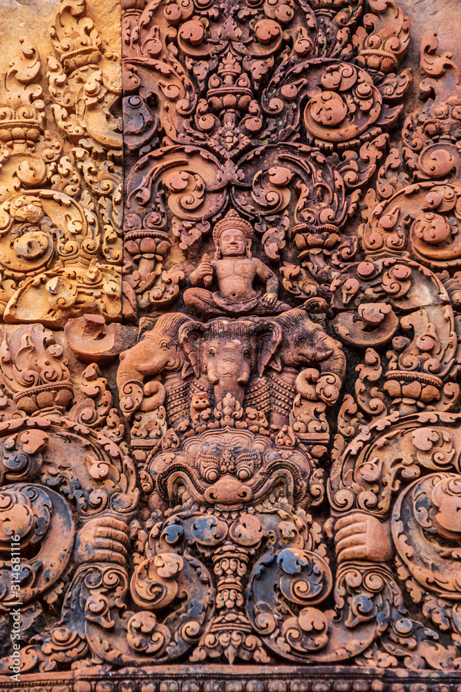 Sculpture of Hindu gods on the wall of Banteay Srei, Angkor Wat, Cambodia