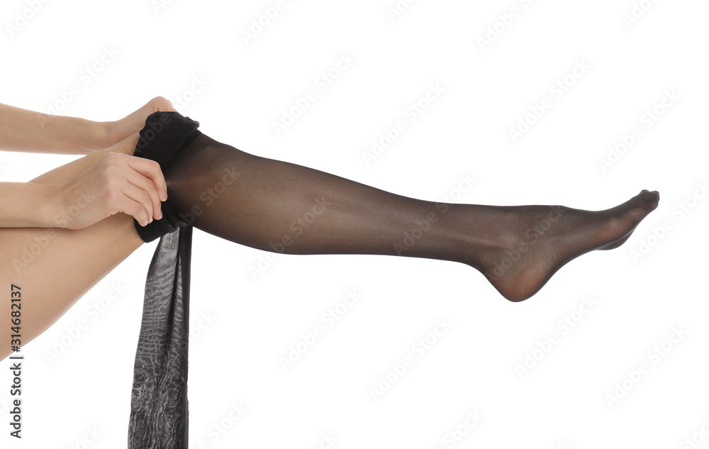 Woman putting on tights on white background, closeup - obrazy, fototapety, plakaty 