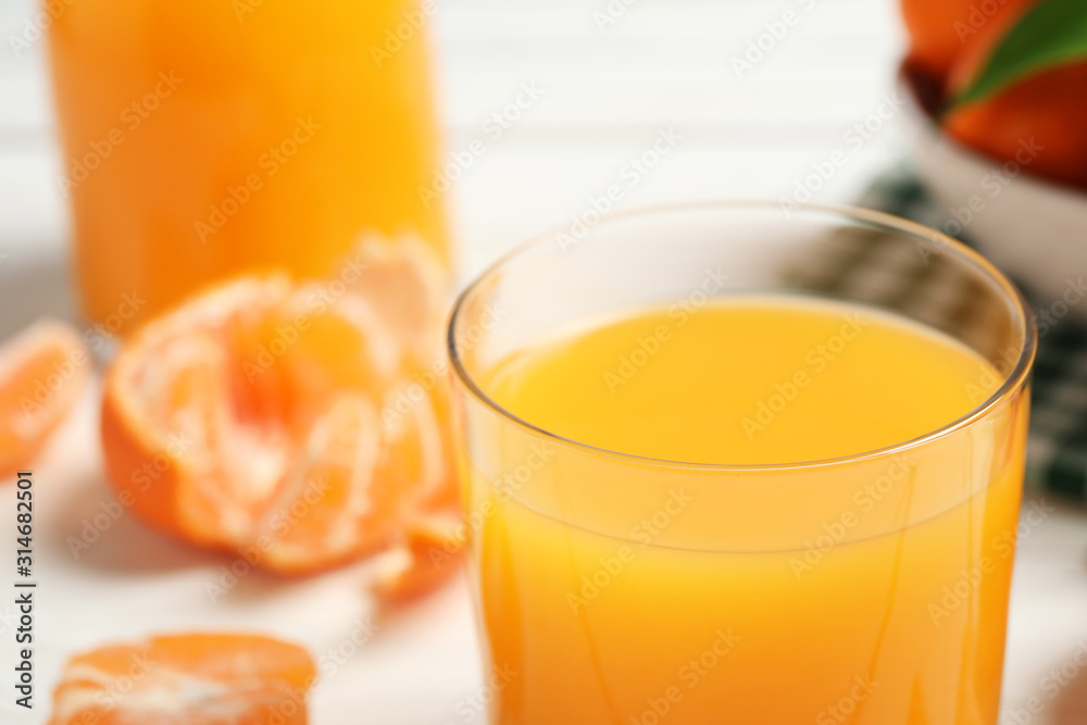 Glass of fresh tangerine juice, closeup view Glass of fresh tangerine juice, closeup view