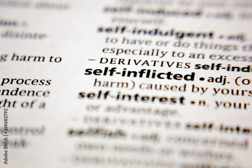Word or phrase self-inflicted in a dictionary. Word or phrase self-inflicted in a dictionary.