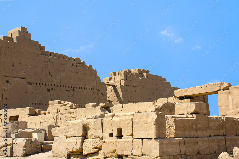 Karnak temple complex in Luxor, Egypt. Ruins of ancient temple Amun-Re with hieroglyphs.