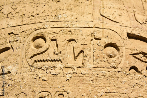 Karnak temple complex in Luxor, Egypt. Ancient bas relief with hieroglyphs on column.