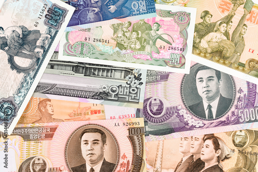 North Korea Won banknotes background. High resolution vintage photo of North Korean bill 2, DPRK money close up macro.