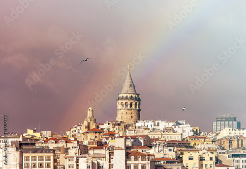 Galata Tower or Galata Kulesi in Istanbul after Rain with Rainbow on Sky, Turkey