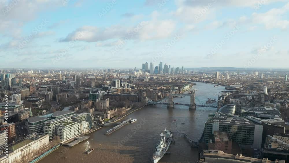 London city centre aerial panorama view: financial district, Thames river, Belfast, skyscrappers, warf and buildings and St. Pauls Cathedral, Tower Bridge and The Tower London city centre aerial panorama view: financial district, Thames river, Belfast, skyscrappers, warf and buildings and St. Pauls Cathedral, Tower Bridge and The Tower