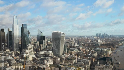 London city centre aerial panorama view: financial district, Thames river, Belfast, skyscrappers, warf and buildings and St. Pauls Cathedral, Tower Bridge and The Tower