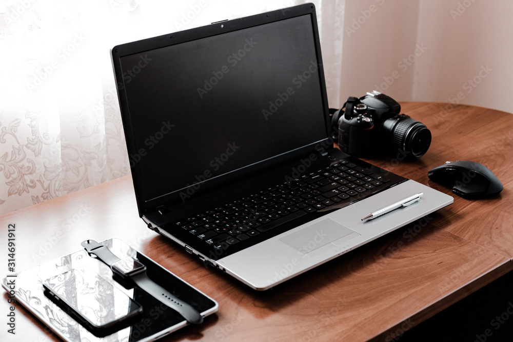 Working space of Photographer or Designer which including of dslr camera lens and wireless mouse on wood desk. Smart Phone, Smart Watch, computer and mouse, tablet for professionals photographer. Working space of Photographer or Designer which including of dslr camera lens and wireless mouse on wood desk. Smart Phone, Smart Watch, computer and mouse, tablet for professionals photographer.