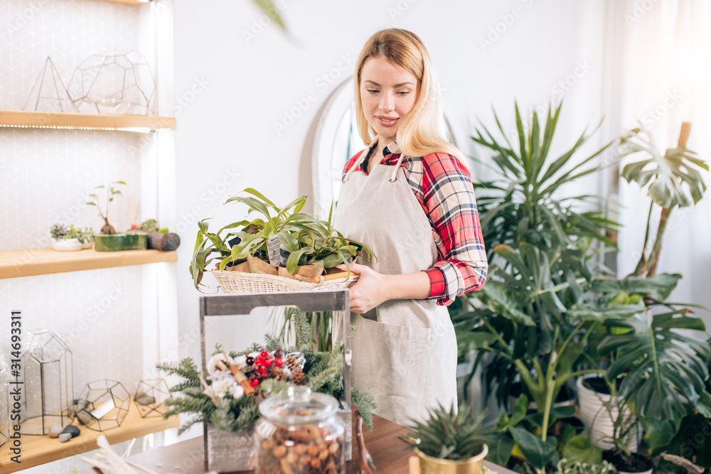 beautiful caucasian woman keen on flora and plants, enjoy working in flowers retail store or to have own shop of flowers.