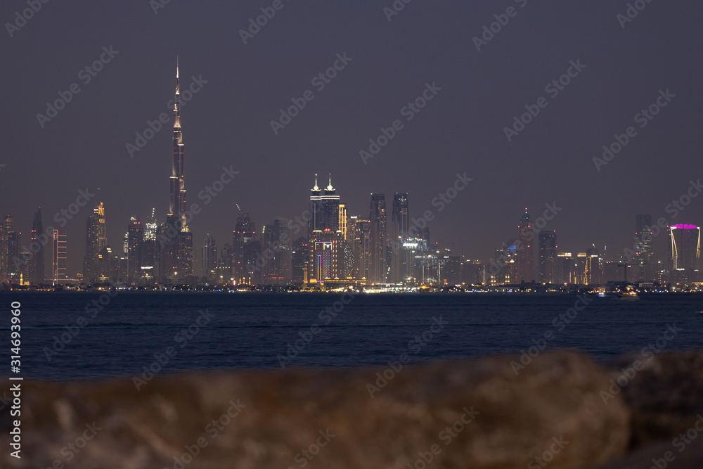 Stunning view of the Dubai skyline during a clear night. Dubai is the largest and most populous city in the United Arab Emirates (UAE)