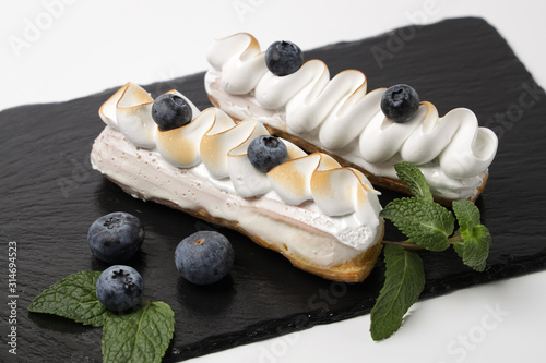  chocolate eclair on a white background