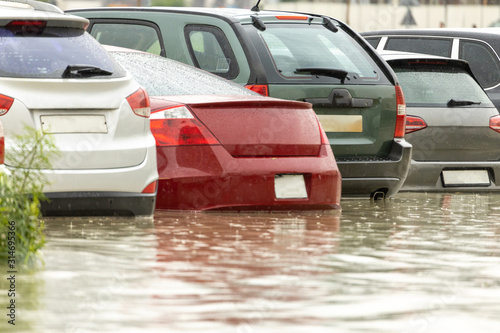 Cars stuck in water in a flooded parking lot after heavy in rain in Dubai