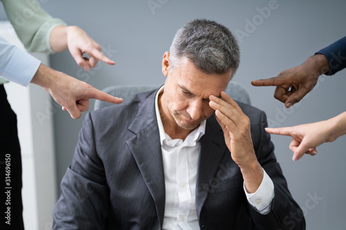 Fotografie Many Hands Pointing The Stress Businessman