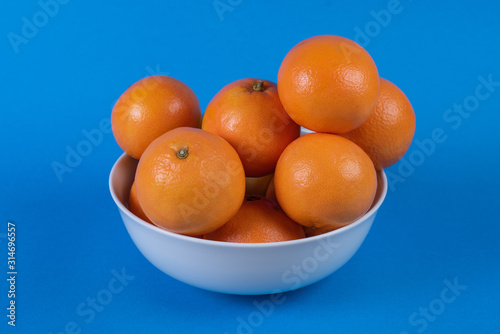 group of oranges with blue background
