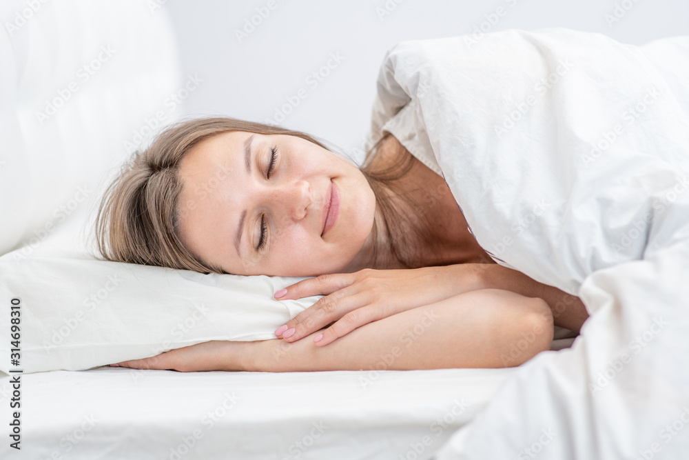 Beautiful woman sleeps in the bedroom at home Beautiful woman sleeps in the bedroom at home