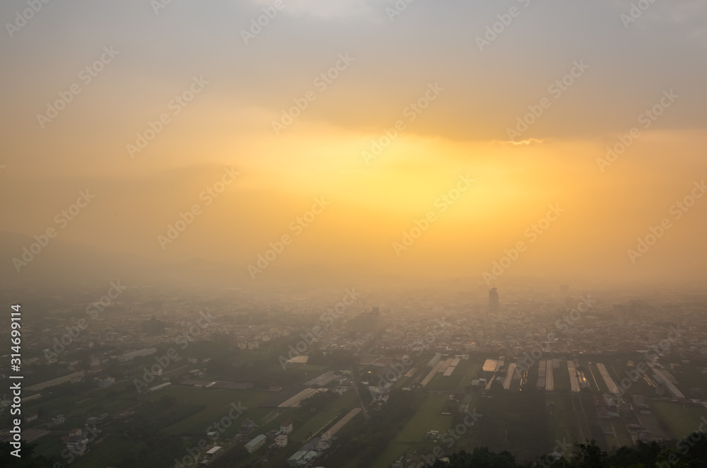 Naklejka premium sunset cityscape of Puli town