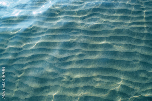Beautiful sand under water with a sparkle of water
