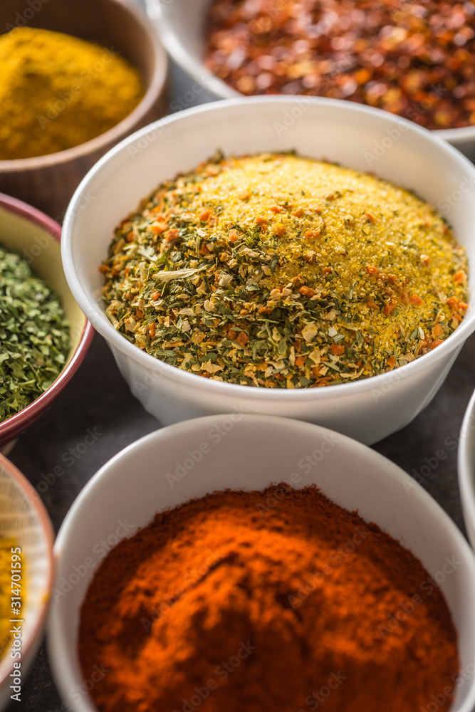 Vegeta and variety spices and herbs in bowls. Dry vegetable with salt and herbs Vegeta and variety spices and herbs in bowls. Dry vegetable with salt and herbs