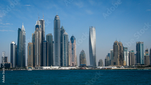 view of the beach and skyscrapers from the promenade of the artificial island Palm Jumeirah  Dubai  UAE
