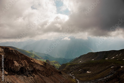View at dry riverbed under dark clouds