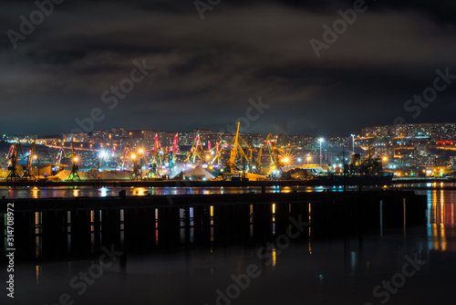night Murmansk, city lights reflected in the Bay and the ships standing in the port © Павел Чигирь