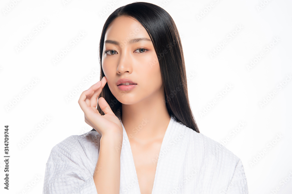 Beautiful Young Asian Woman with Clean Fresh Skin. Face care, Facial treatment, on white background, Beauty and Cosmetics Concept. Beautiful Young Asian Woman with Clean Fresh Skin. Face care, Facial treatment, on white background, Beauty and Cosmetics Concept.