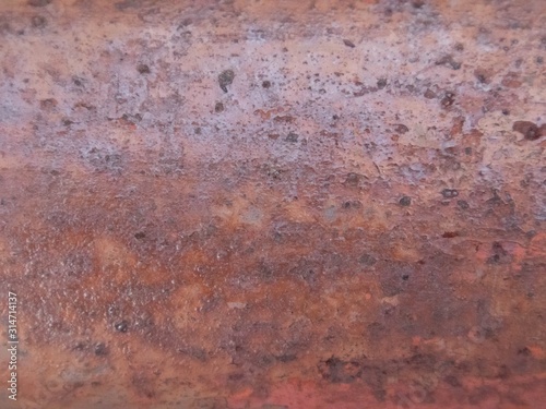 Rusted metal wall. Rusty metal background with streaks of rust.oxidized.