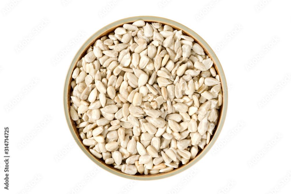 top view cleaned organic sunflower seeds in a bowl isolated on white background.