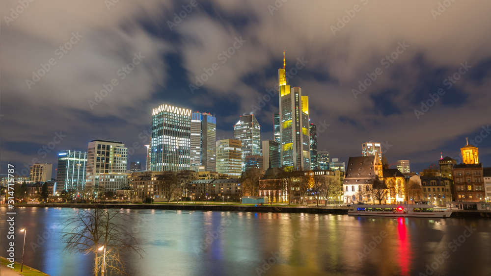 The Skyline of Frankfurt by night, seen from the river Main. 