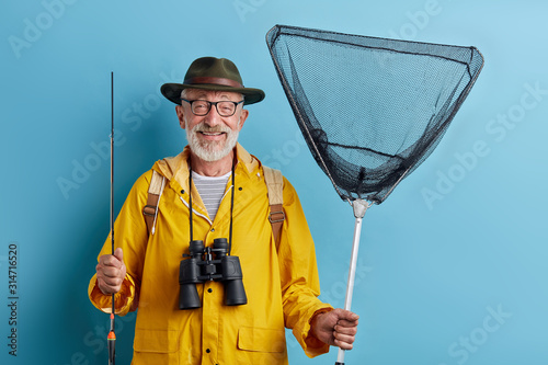 overjoyed man spending time on the bank of river, best holiday, weekend, happy old age, life in pleasure, careless life. close up photo