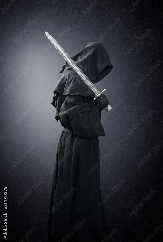 Ghostly figure with medieval sword in the dark with clipping path Ghostly figure with medieval sword in the dark with clipping path