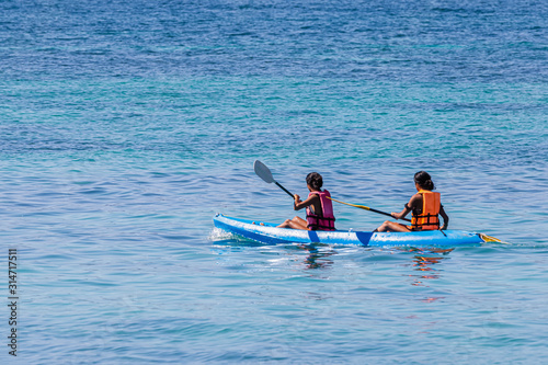 Tourists canoeing on the beautiful sea around Lipe Island, Satun, Thailand