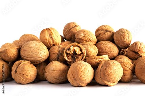a large number of walnuts on a white background