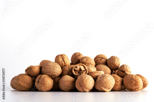 a large number of walnuts on a white background