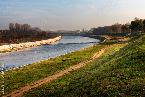 Nisava River on the outskirts of the City of Nis in Serbia, with walking and jogging paths and parks. photo