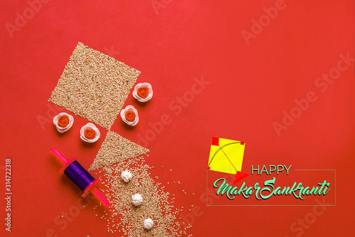 Indian festival makar sankrant concept, Colorful kite ,string and sweet sesame seed ball. photo