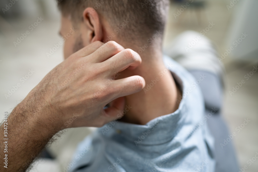 Man Scratching Itch On His Neck