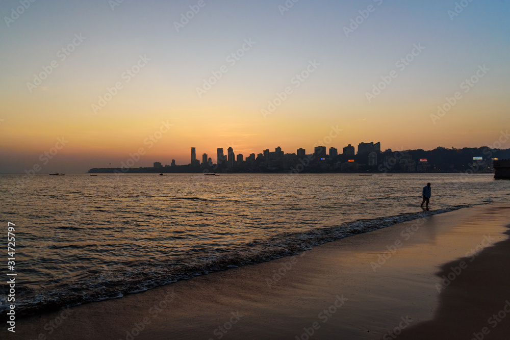 Sunset on Chowpatty beach in Mumbai. India