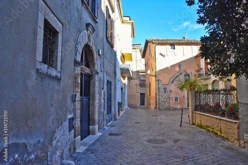 Fototapeta Naklejka Na Ścianę i Meble -  Alatri, Italy, 01/03/2020. A narrow street between the old houses of a medieval village