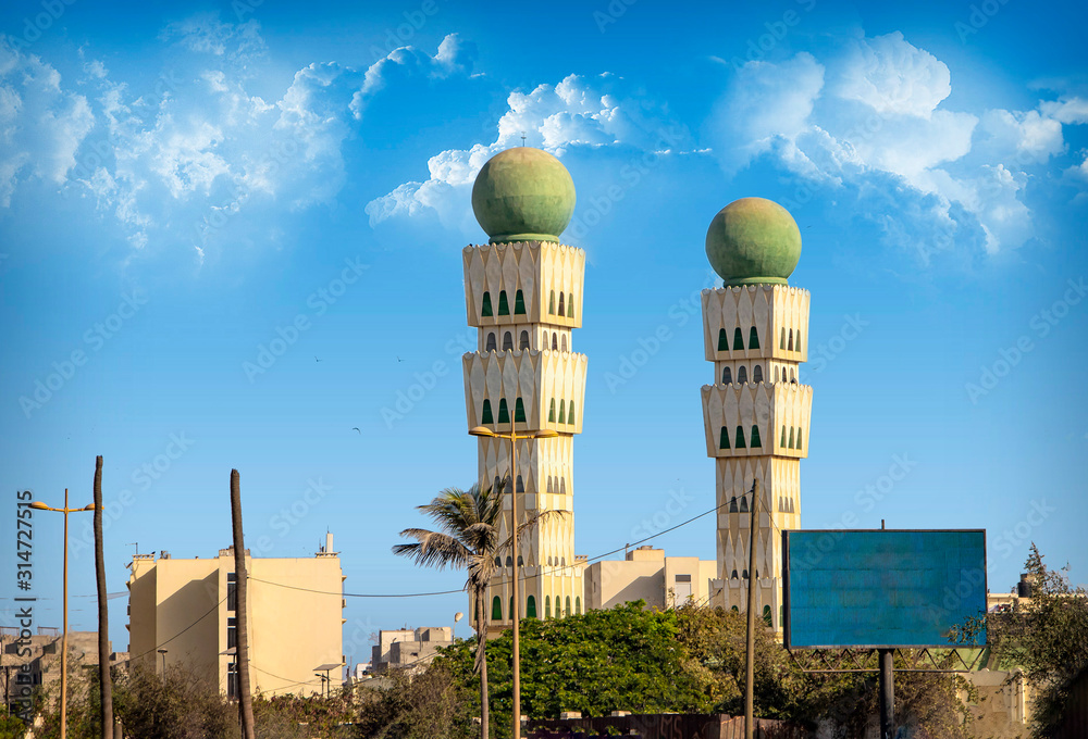 Fototapeta premium White towers of the Mosque of the Divinity in the capital of Senegal, Dakar, Africa.