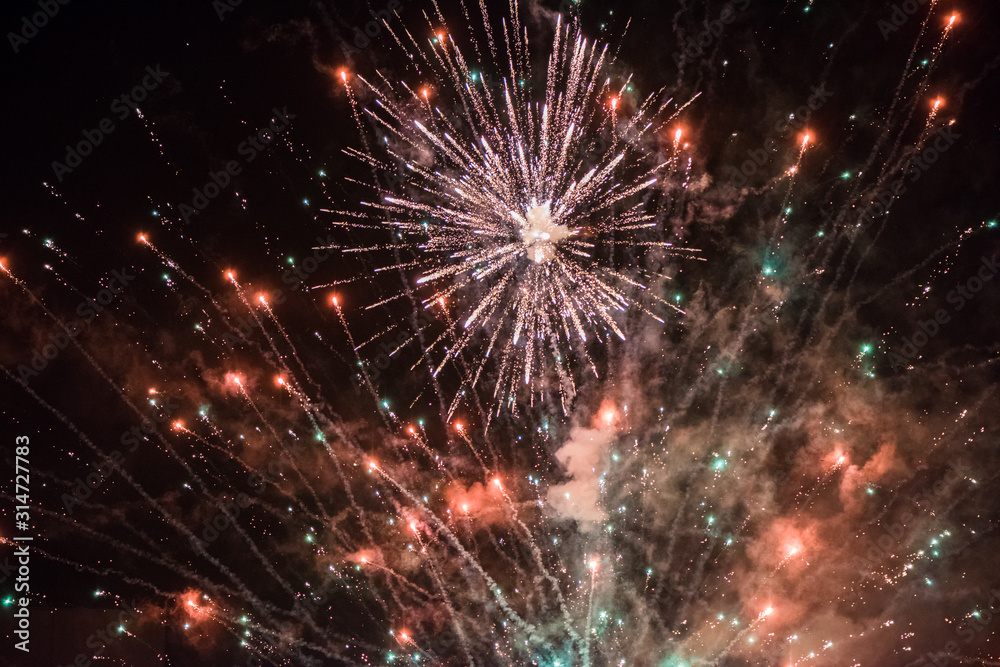 Celebratory colorful  fireworks light up the night sky. closeup. New year